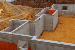Waterproofing a new house foundation with cement filled of a private house